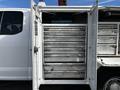 A 2017 Ford F-350 SD with open service doors revealing multiple metal tool drawers arranged in a vertical stack