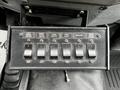 Control panel with six switches labeled for various work lights and a beacon on a 2016 Ford F-550