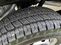 Close-up of a tire on a 2018 Ford Transit showing a tread pattern designed for grip and durability