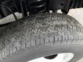 Close-up of a tire from a 2019 Ford Econoline showing the tread pattern and wear characteristics
