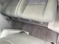 Interior view of a 2007 Chrysler PT Cruiser showing the front passenger seat and floor mats in gray upholstery