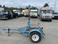 A blue 2003 U-Built Reel Trailer with a single wheel and a mounted reel system on the back