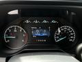 The dashboard of a 2024 Ford F-550 displaying gauges for engine hours speedometer and odometer along with a digital screen showing engine details and total hours driven