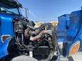 A blue 2008 Peterbilt 340 truck with its engine exposed revealing various mechanical components including hoses and wiring