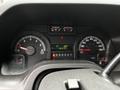 Dashboard of a 2013 Ford Econoline displaying speedometer RPM gauge fuel gauge and odometer reading 187391 kilometers