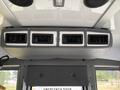 The interior of a 2020 Chevrolet Express featuring a ceiling-mounted air vent system with multiple vents and a sleek gray trim