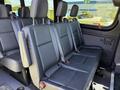 Interior seating of a 2023 Mercedes-Benz Sprinter with black leather seats and seat belts visible