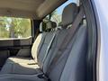 Interior view of the backseat of a 2017 Ford F-350 SD showing gray fabric seats with seat belts