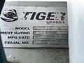 A metal nameplate for a Tiger crane displaying model number 503E, a moment rating of 5686, manufacturing date, and serial number 1279.