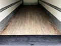 A 2020 Hino 338 box truck with an empty cargo area featuring a wooden floor and metal walls