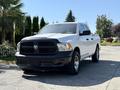 A 2019 RAM 1500 Classic pickup truck in white with a black front grille and chrome wheels parked on a driveway