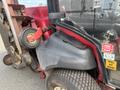 A 2014 Toro Groundmaster 5910 with a red and black exterior showing its engine compartment and attached mower deck components