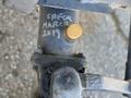 Close-up of a metal component from a 2010 Kubota F3680 with markings and a yellow cap visible on a shaft