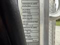 A 2016 Peterbilt 348 vehicle identification plate displaying specifications including tire size and pressure information
