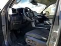 Interior view of a 2023 Toyota Tundra showing the driver's seat dashboard steering wheel and control panel