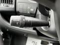 Close-up of a 2021 RAM Promaster steering wheel control lever featuring settings for cancel and resume with an on-off switch