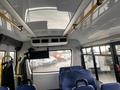 Interior view of a 2018 Chevrolet Express showing overhead features and seating arrangement with a focus on the spacious cabin design