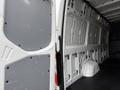 Interior view of a 2019 Mercedes-Benz Sprinter van showcasing the cargo area with grey paneling and a clean floor