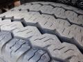 Close-up of a tire tread on a 2016 Mercedes-Benz Sprinter showing a detailed pattern of grooves and ridges designed for traction