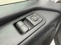 A control panel for window and mirror adjustments in a 2019 Mercedes-Benz Sprinter featuring buttons for window locks and side mirror positioning