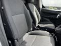 Interior view of a 2016 Ford Transit Connect showing two front bucket seats with gray fabric upholstery and patterned accents