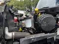 A close-up view of the engine bay of a 2017 International WorkStar 7600 showing various components including hoses and fluid reservoirs
