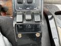Control panel of a 2012 Toro Groundsmaster featuring multiple black levers with rubber grips and directional arrow indicators