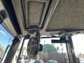 Interior view of a 2010 Kubota F3990 showing a ceiling fan and a textured overhead panel