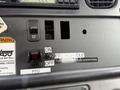 Dashboard control panel of a 2005 Freightliner M2 106 with switches for engine brake and PTO settings