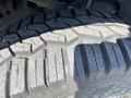 Close-up of a rugged tire tread from a 2017 Ford F-150 showing deep grooves and textured surface designed for off-road traction