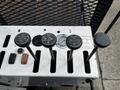 Four control levers labeled for various functions on a machine, each with distinct markings such as LEFT TURN and DOWN MINCH