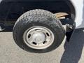 Wheel of a 2013 Ford F-250 SD featuring a rugged tire tread and a metallic wheel rim