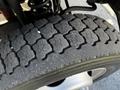 Close-up of a treaded tire from a 2018 Ford F-550 showing detailed patterns and grooves on the rubber surface