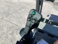 Close-up of the control joystick for a 2022 TerraMac Tracked Dump featuring buttons and a green indicator light