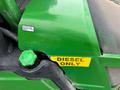 A green diesel tank cap labeled "DIESEL ONLY" on a 2014 John Deere 1585 Terrain Cut mower with a visible fuel label indicating ultra low sulfur fuel only