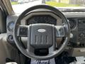 The interior view of a 2008 Ford F-550 dashboard and steering wheel showing the gauges and control knobs