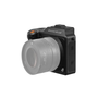 A Hasselblad X2d 100c medium format mirrorless camera with a large lens and a black body featuring an orange shutter button and a textured grip
