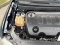 Engine compartment of a 2013 Dodge Journey showing the engine and coolant reservoir