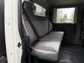 The interior of a 2012 International TerraStar featuring a single bench seat with seatbelts