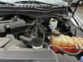 A close-up view of the engine compartment of a 2017 Ford F-250 showing various engine components and fluid reservoirs