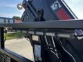 2012 Freightliner M2 112 truck with a mounted lifting mechanism featuring LED lights along the top edge of the apparatus