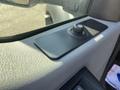 An interior door panel with a control switch and knob for the 2015 Ford F-450 SD