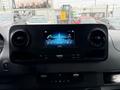 The dashboard of a 2022 Mercedes-Benz Sprinter featuring a digital display with options for radio and media controls