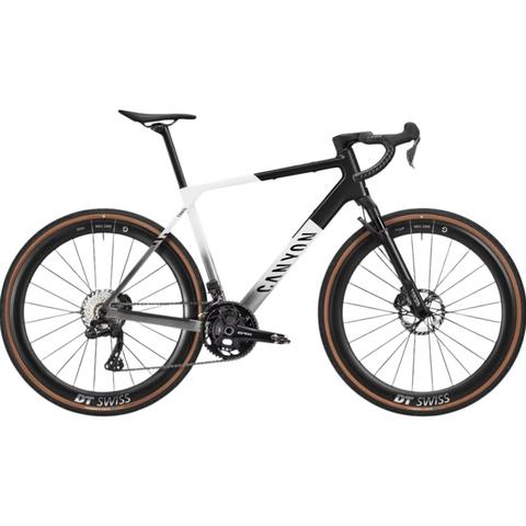 2026 Canyon Grail CFR SRAM Red AXS RIFT Carbon Gravel Road Bike with a sleek design and distinctive black and white color scheme featuring thin tires and disc brakes