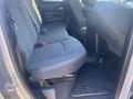 Interior view of the rear seats in a 2021 RAM 1500 truck featuring fabric upholstery and floor mats