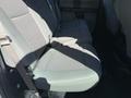 Interior rear seats of a 2017 Ford F-350 SD with gray upholstery and seatbelts