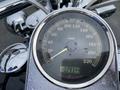 Speedometer of a 2008 Harley-Davidson FLSTFI showing various speed readings with water droplets on the glass displaying the odometer reading of 29344 km