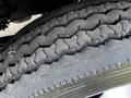 Close-up of a tire from a 2009 Ford LCF 550 showcasing a rugged tread pattern with visible wear and grooves designed for traction