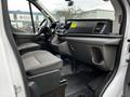 Interior view of a 2020 Ford Transit showing the front dashboard seats and steering wheel with a modern design