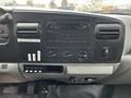 Dashboard of a 2007 Ford F-550 featuring a radio display control panel with knobs for air conditioning and various switches for vehicle functions
